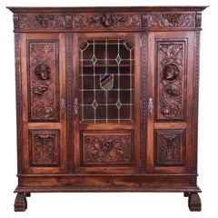 Antique French Ornate Carved Walnut Bookcase with Stained Leaded Glass Door