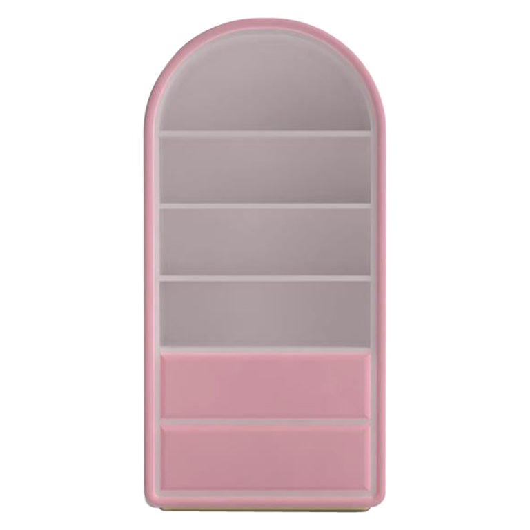 Bubble Gum Kids Bookcase in Pink Velvet by Circu Magical Furniture solves the issue of having a bookcase in a bedroom. 
Circu developed this piece that takes the right amount of space in your kids bedroom and adds extra storage to keep the room