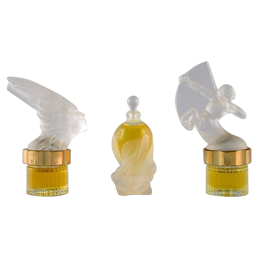 Trois flacons de parfum Lalique. Fin du XXe siècle