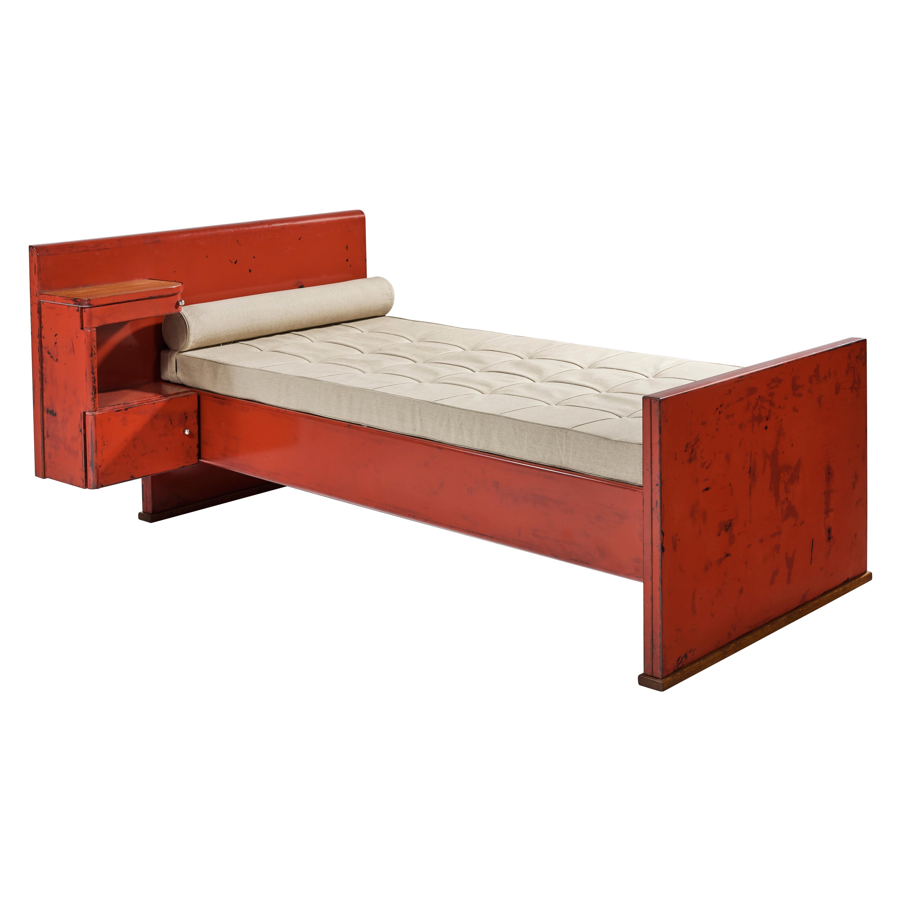 Jean Prouve, 1901-1984
France

Bed with integrated head, 1934 - 1935.
Demountable bed in folded and welded sheet steel, brick lacquer finish. Integrated head and bedside table has drawer and lower cupboard pivoting from single hinge, with shelf