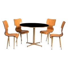 Mid Century Rounded Black Crystal Top and Brass Legs Game Table and Four Chairs