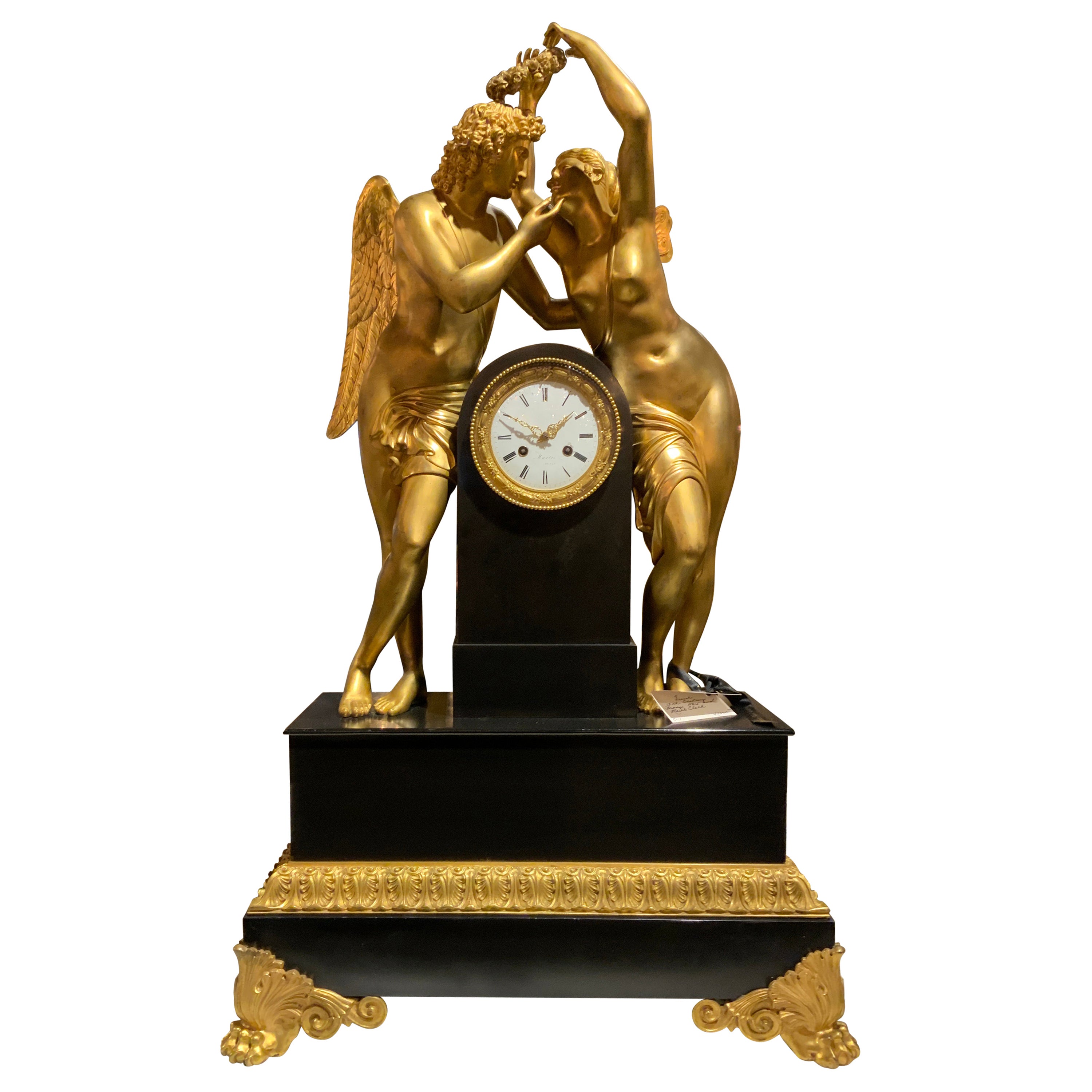 Monumental Marble and Bronze Dore’ Clock Adorned with Psyche and Amor Figures