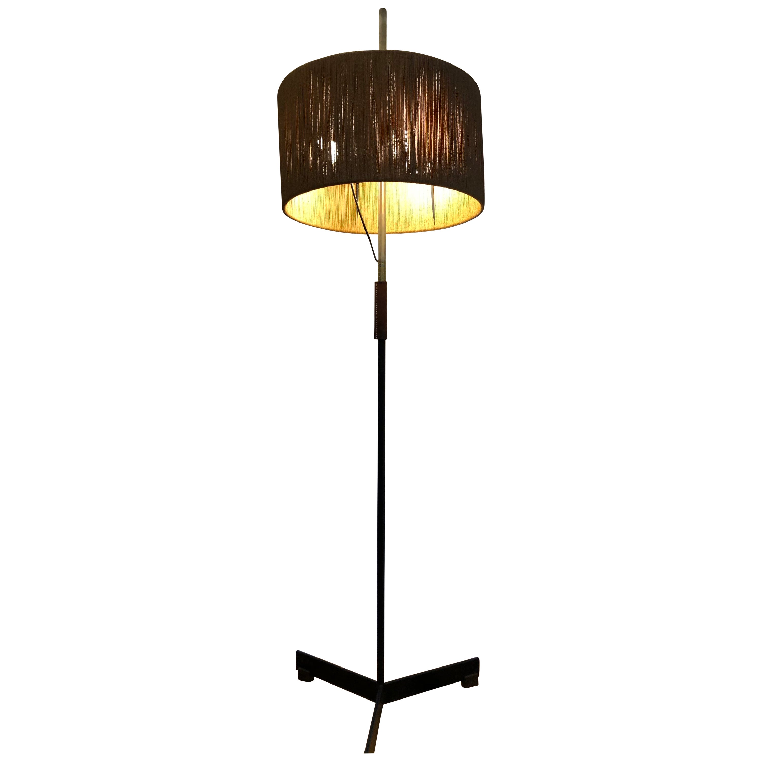 Tall floor lamp made in Vienna /Austria in the late 50‘s or early 60‘s.
Heavy and worthy execution in excellent condition.
A beautiful dark leather wrapping on the shaft.
Has placings for three light bulbs and a wonderful flax wrapped lamp