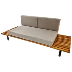 Cansado Bench in Oak Wood and Grey Fabric Cushion by Charlotte Perriand