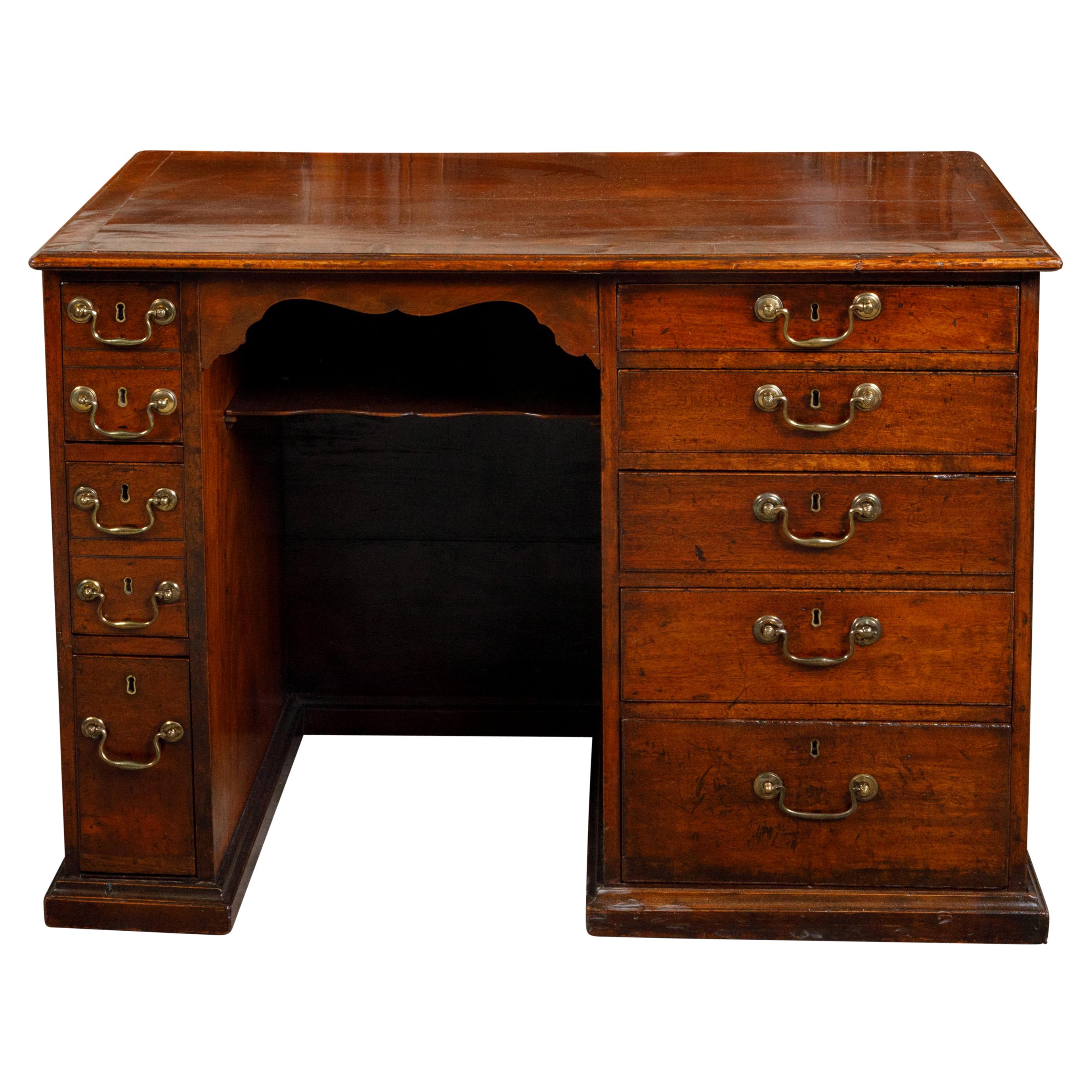 English Georgian Period Mahogany Desk with Ten Graduating Drawers and Shelf For Sale