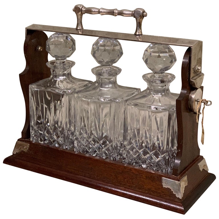 English Whiskey Tantalus, Mahogany, 3 Crystal Decanters at 1stDibs