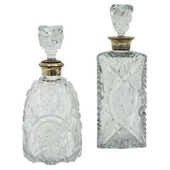 Unmatching Pair of Cut Crystal and Silver Liqueur Decanters