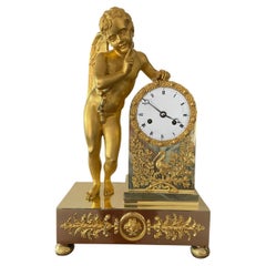 French Gilt Brass Mantel Clock with Winged Cherub, Circa 1830