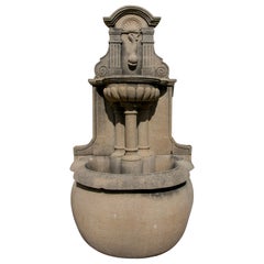 1990s Spanish Hand Carved Grey Sandstone Wall Fountain w/ Trough & Fish Spout