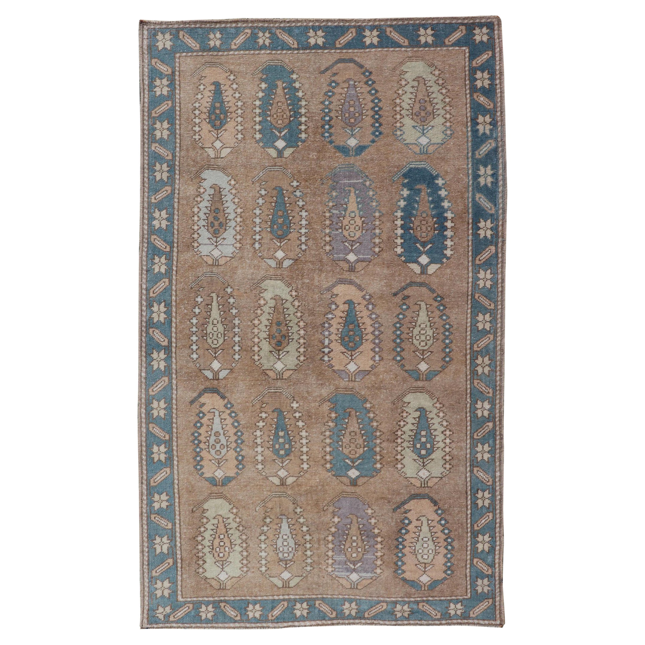 Vintage Turkish Tulu Rug with large Scale Paisley Design in Tans, Brown and Blue