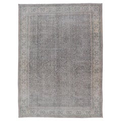 Vintage Hand-Knotted Distressed Turkish Rug in Wool with All-Over Floral Pattern