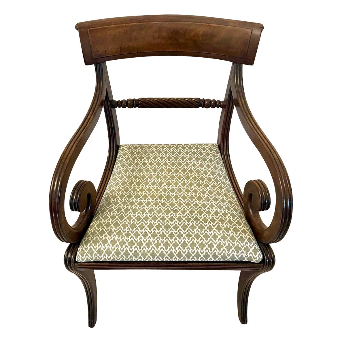 Quality antique regency mahogany desk chair having a quality shaped figured mahogany back with a rope twist turned centre rail, lovely shaped scrolled open arms, newly reupholstered drop in seat in a quality fabric, reeded frieze and standing on