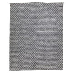 Tapis moderne en laine grise de la collection Safi d'Amadana, fait à la main et entièrement conçu