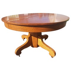 Ancienne table de salle à manger américaine à piédestal en chêne sur roues, vers 1900