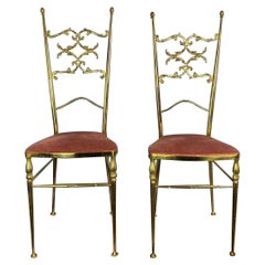 A Pair Of Antique Bronze Chairs With Red Velvet Seat