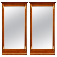 Pair of 19th Century Neoclassical St. Wood, Brass, and Pressed Metal Mirrors