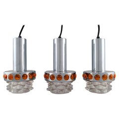 RAAK, Holland, Three Ceiling Pendants in Chromed Metal and Art Glass, 1970s