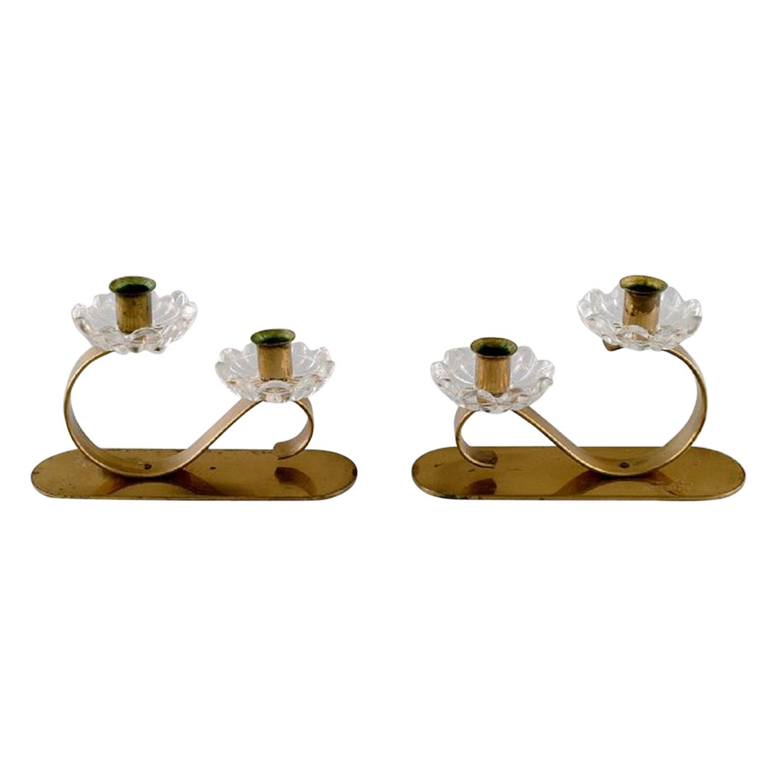 Gunnar Ander for Ystad Metall, Two Candlesticks in Brass and Clear Art Glass For Sale
