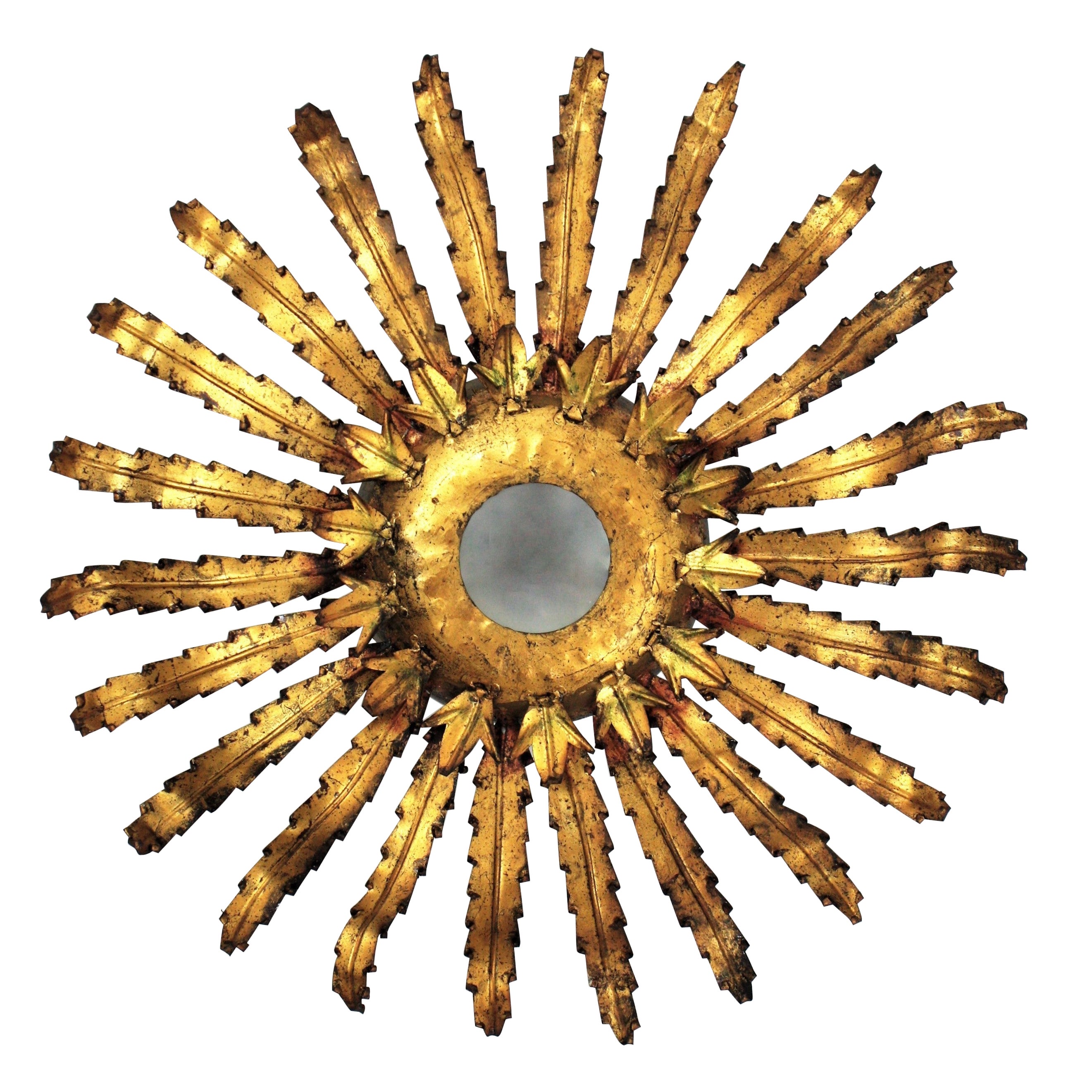 Sunburst Flush mount with leafed frame, gilt iron, Spain, 1950-1960
Design combining brutalist and neoclassical accents.
This eye-catching ceiling light fixture will be gorgeous placed on a dark background.
Use it flush mounted or hanging from a