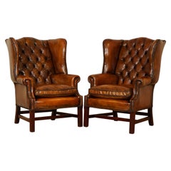 Pair of Fully Restored Hand Dyed Chesterfield Wingback Chairs with Feather