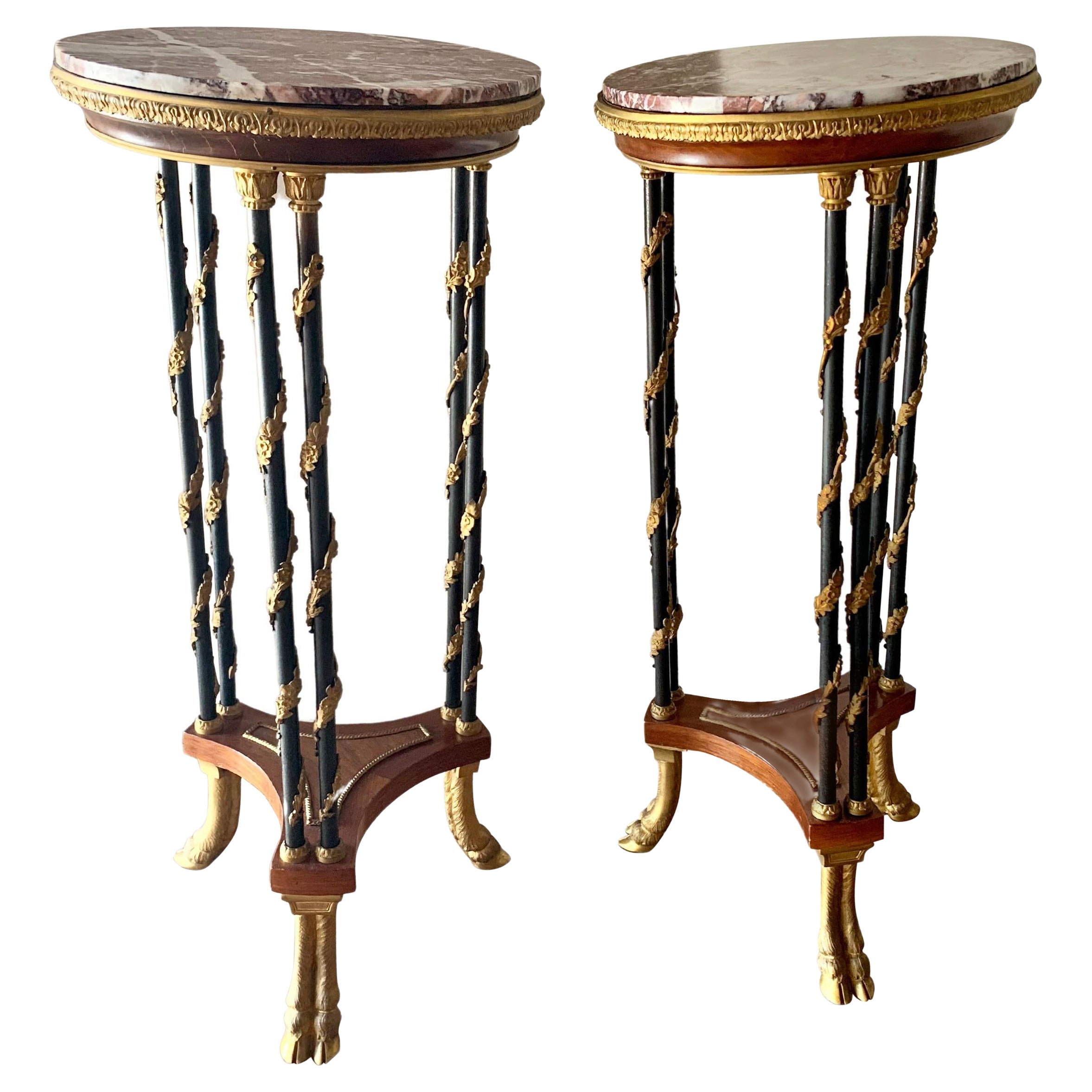 Whismical pair of gueridon in ormolu bronze with marble, this pair can be attributed to henry dasson famous cabinet maker. This model with the bronze that suuounds the feet is very rare on the market.