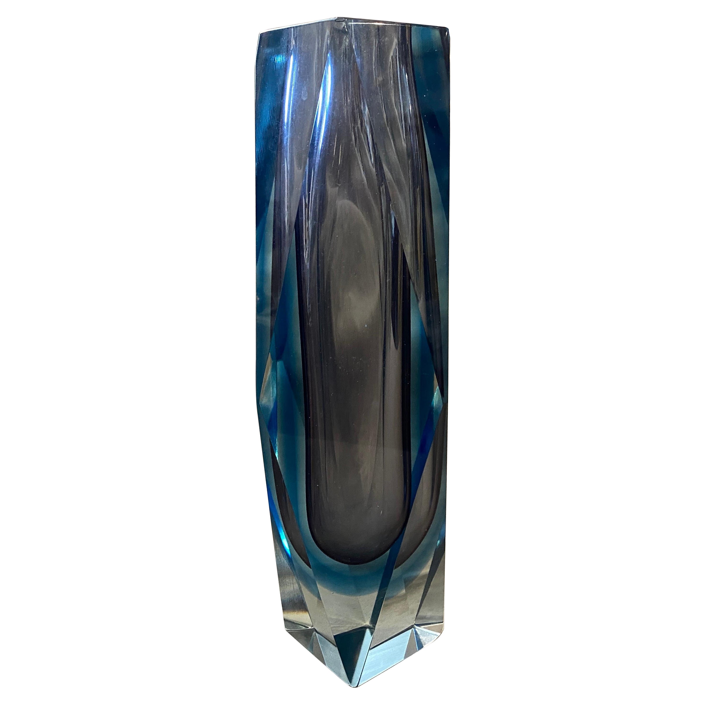 An iconic murano glass vase made in the Seventies. the light blue and purple heavy glass it's in perfect condition.