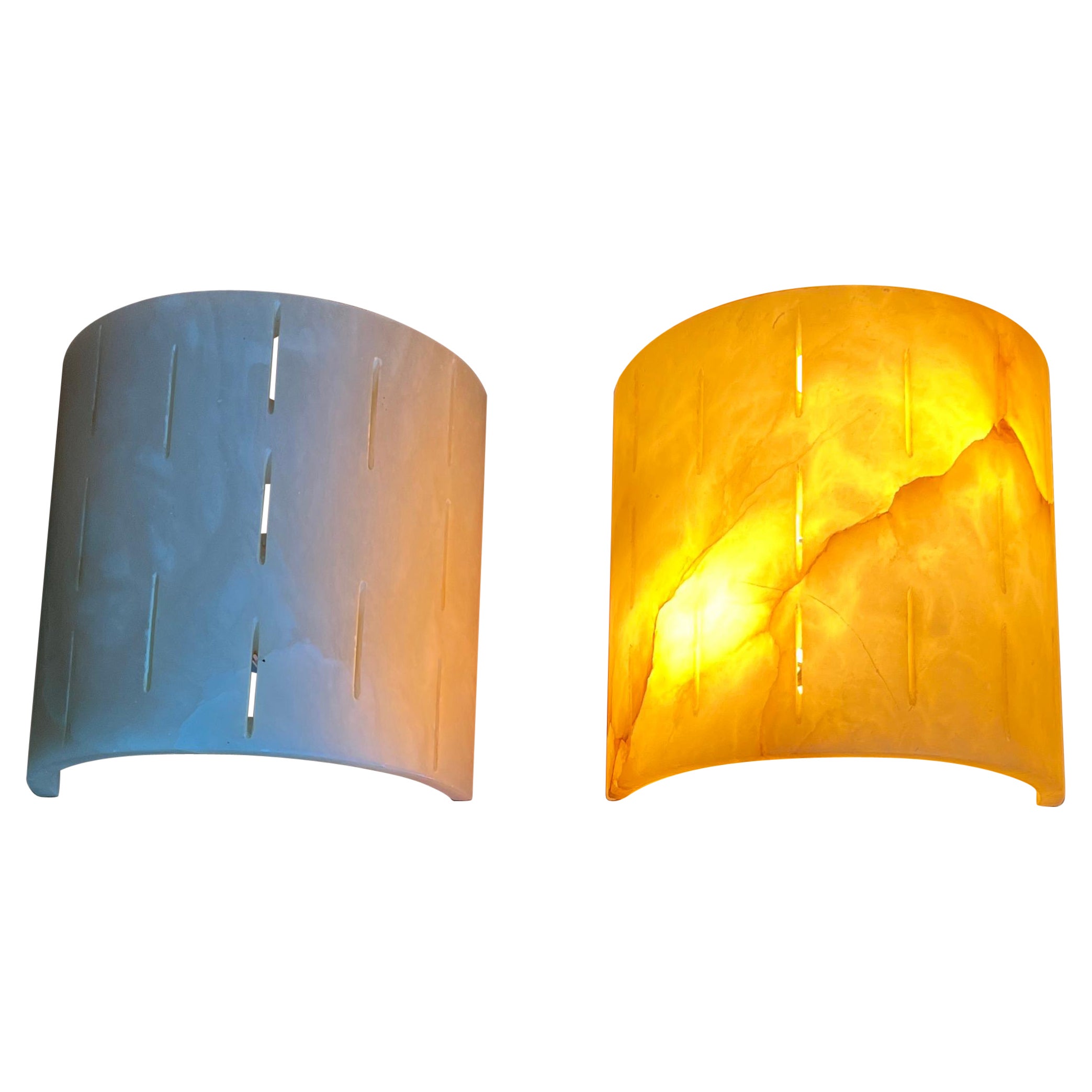 Handcrafted and very stylish pair of midcentury made alabaster 2-light (up & down) wall lights.

If you are looking for a great shape and practical size pair of sconces to grace your living space then these natural mineral stone fixtures could be
