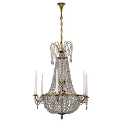 French Louis XVI Style Brass and Crystal Basket Nine-Light Chandelier