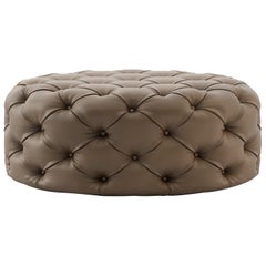 Contemporary round pouf, customisable in fabric and leather