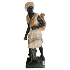 Escultura de ónice y mármol tallada a mano de los años 90 de un personaje aguador