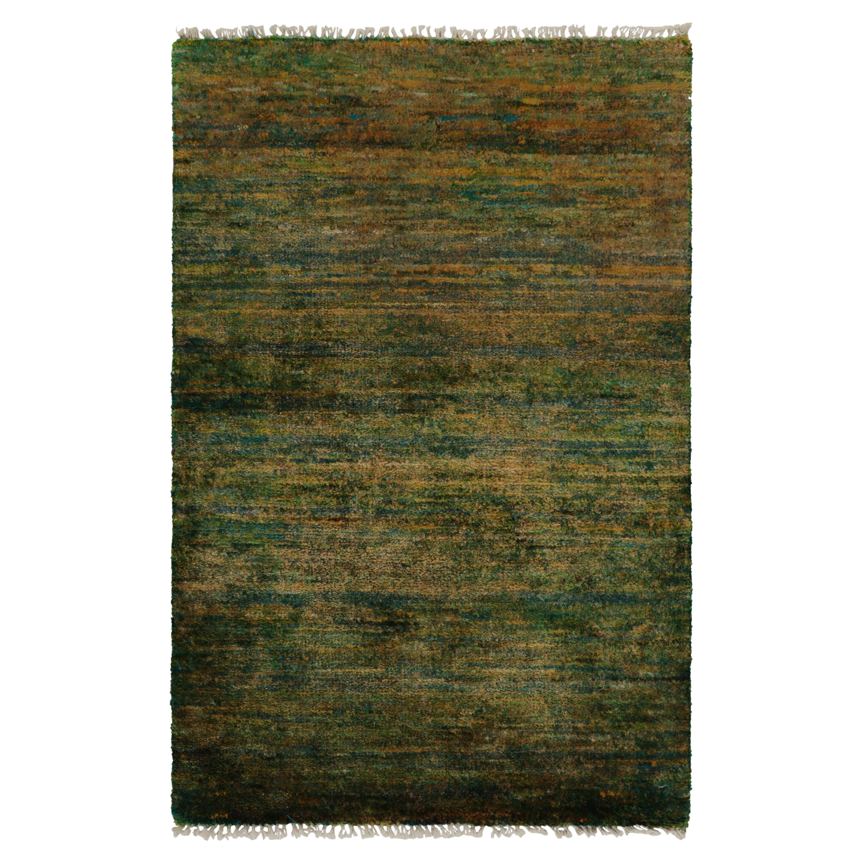 Rug & Kilim introduces its refined take on modern aesthetics with this smart, solid rug in 2x3 rug from our Texture of Color collection. The contemporary piece revels in a rejuvenating yet luscious colorway of luxurious green & gold with blue accent