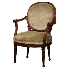 19th Century French Louis XVI Carved Walnut and Velvet Bergere Armchair