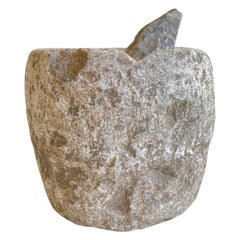 Ensemble de mortier et de pilon en pierre antique