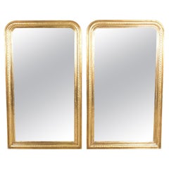 Paire de grands miroirs anciens en bois doré de style Louis Philippe français
