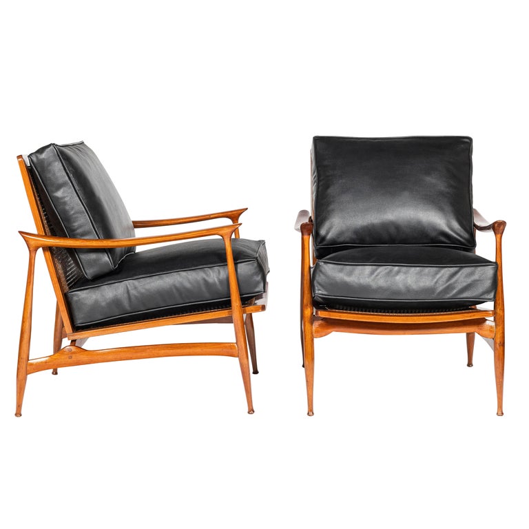 Pair of wood, rattan and leather Scandinavian armchairs, circa 1960.