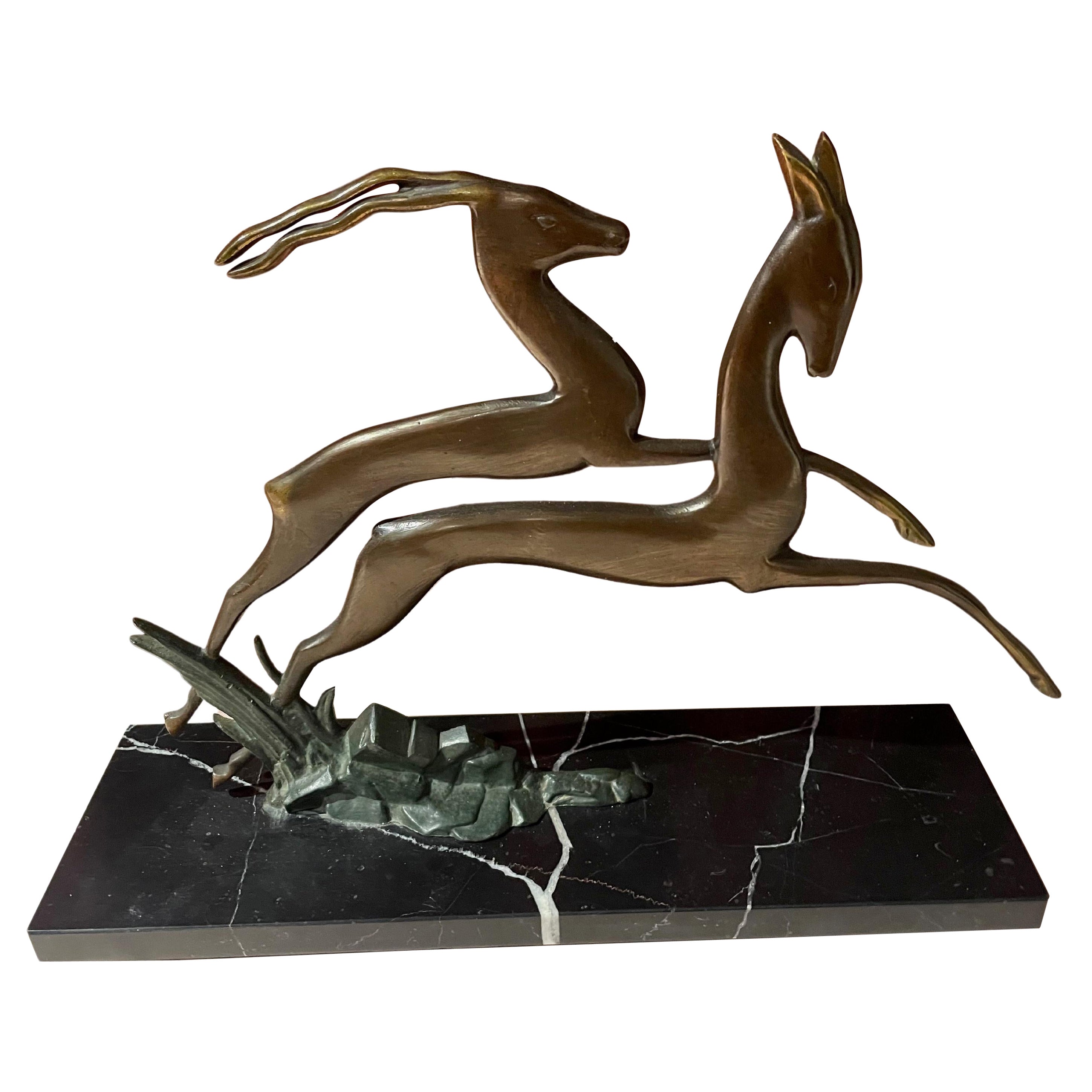 Paire de Gazelle Art Déco en bronze en cuir sur socle en marbre