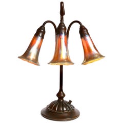 Used Tiffany Studios Three Light Lily Favrile and Bronze Lamp