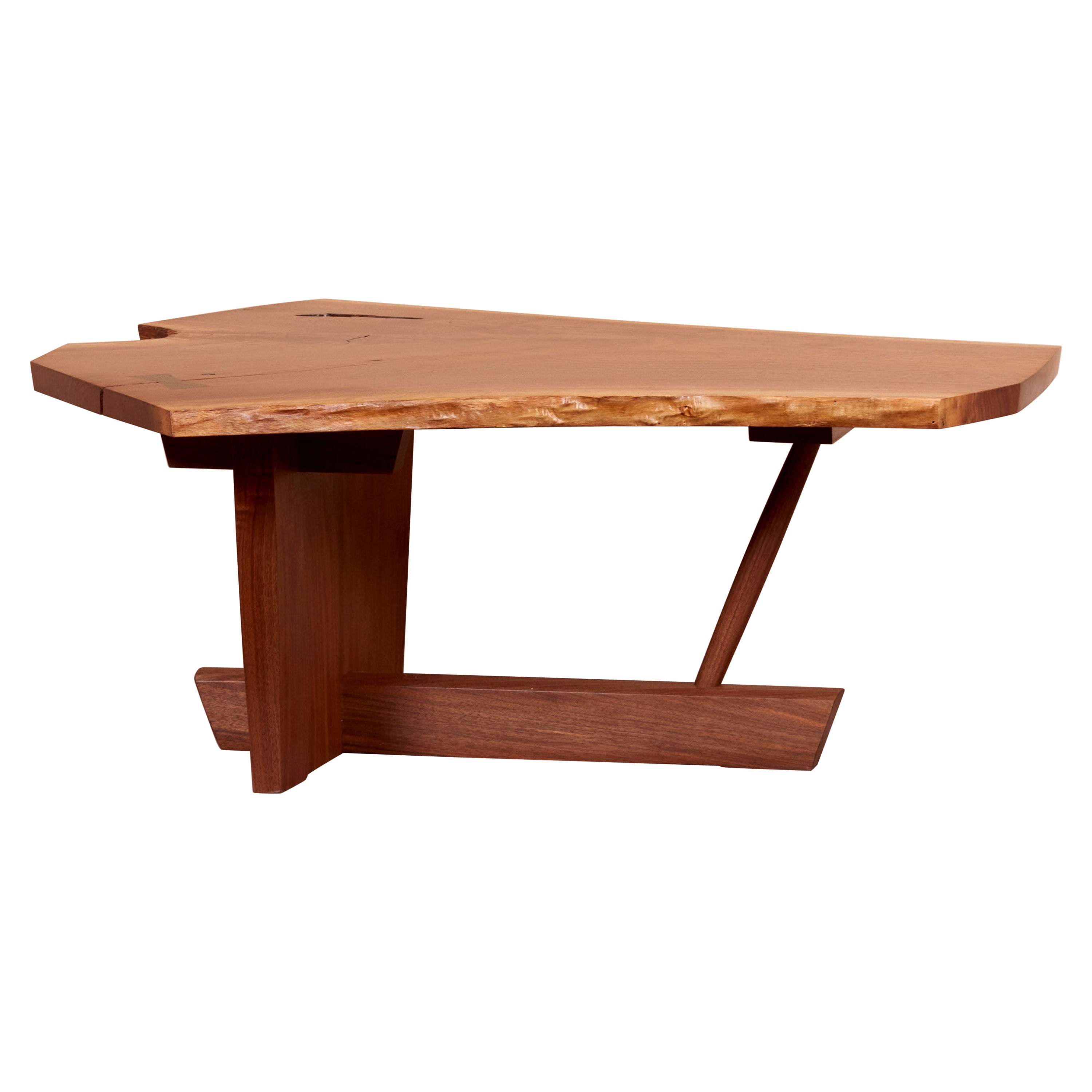 Minguren II coffee table by Mira Nakashima based on a design by George Nakashima in black walnut. Due to the unique wood structure of each item the table is not identical but similar to the one pictured above. Measurements may vary.  Please consider