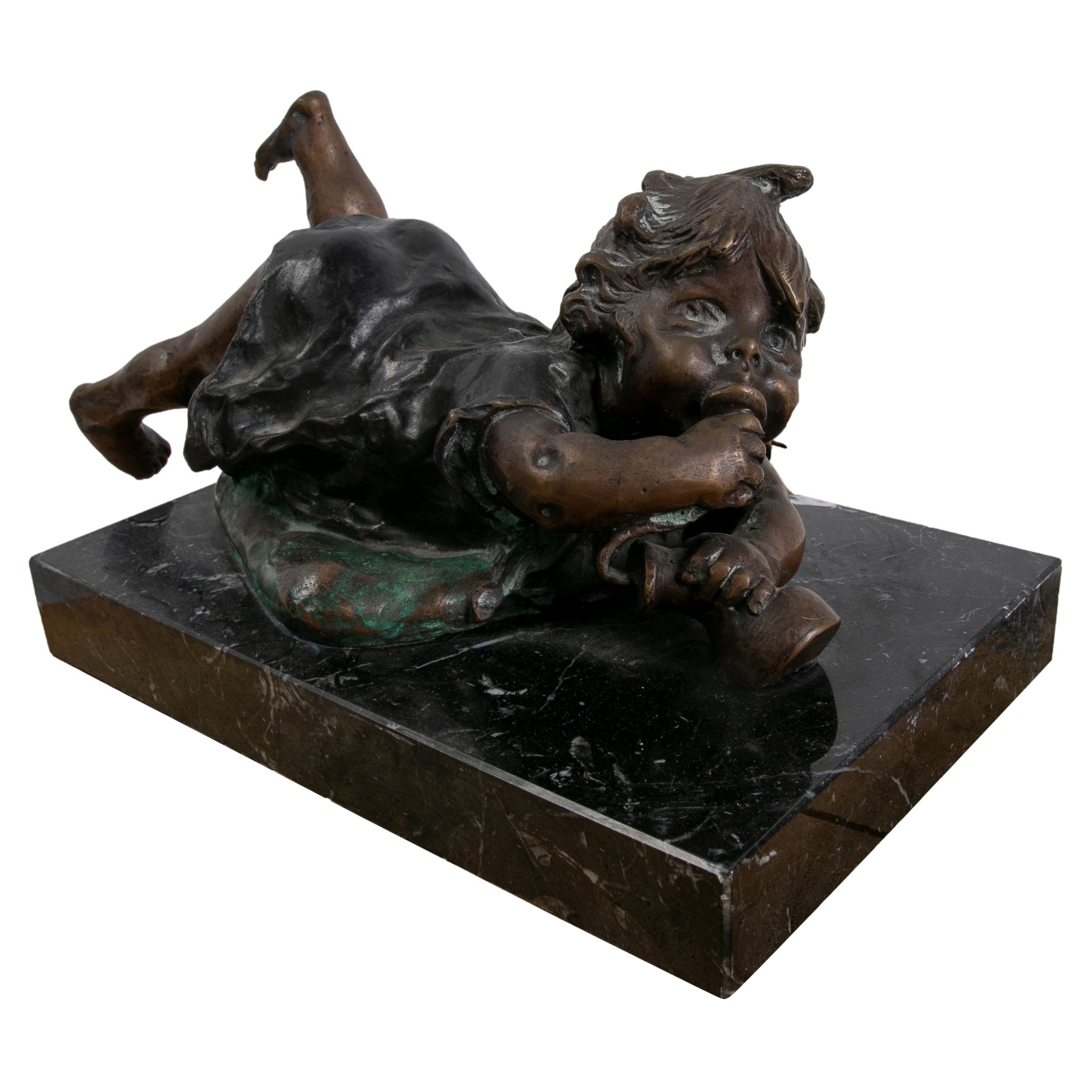 Bronze Sculpture with Marble Base of a Little Girl Lying Down.