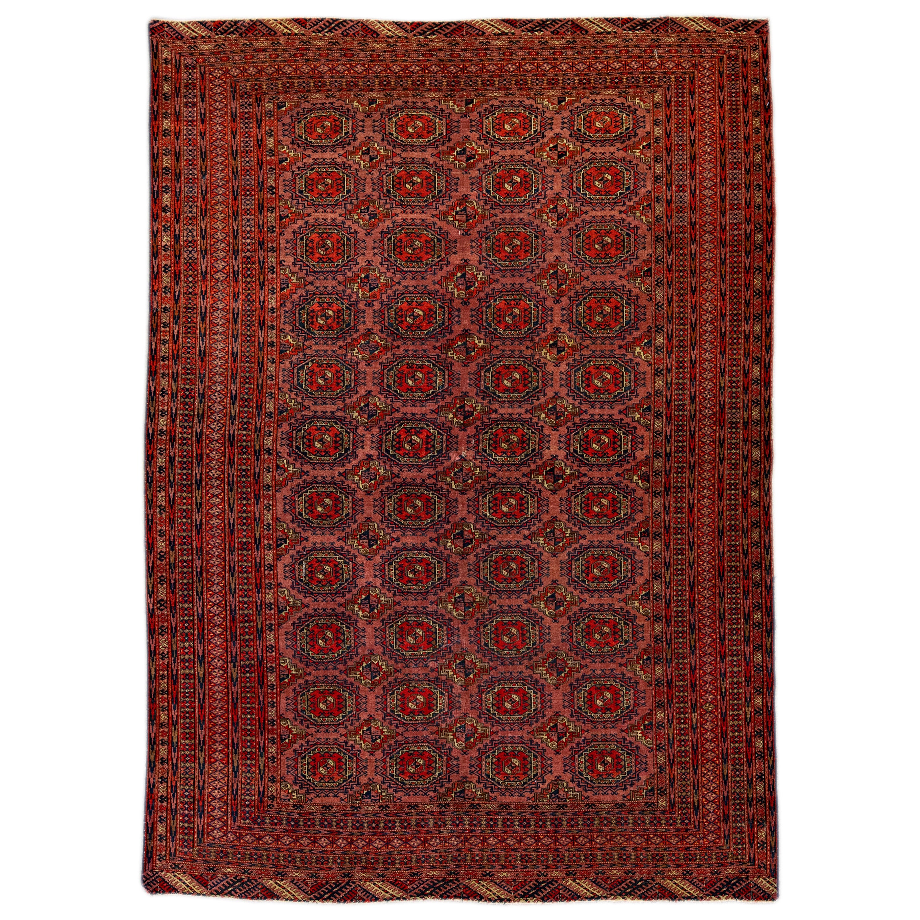 Tapis vintage turkmène géométrique en laine persane fait à la main avec couleur terre cuite