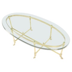 Grande table basse italienne ovale en laiton massif avec pieds en forme de sabot et plateau en verre