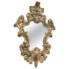 Miroir ancien richement sculpté et argenté, Italie, 18ème siècle