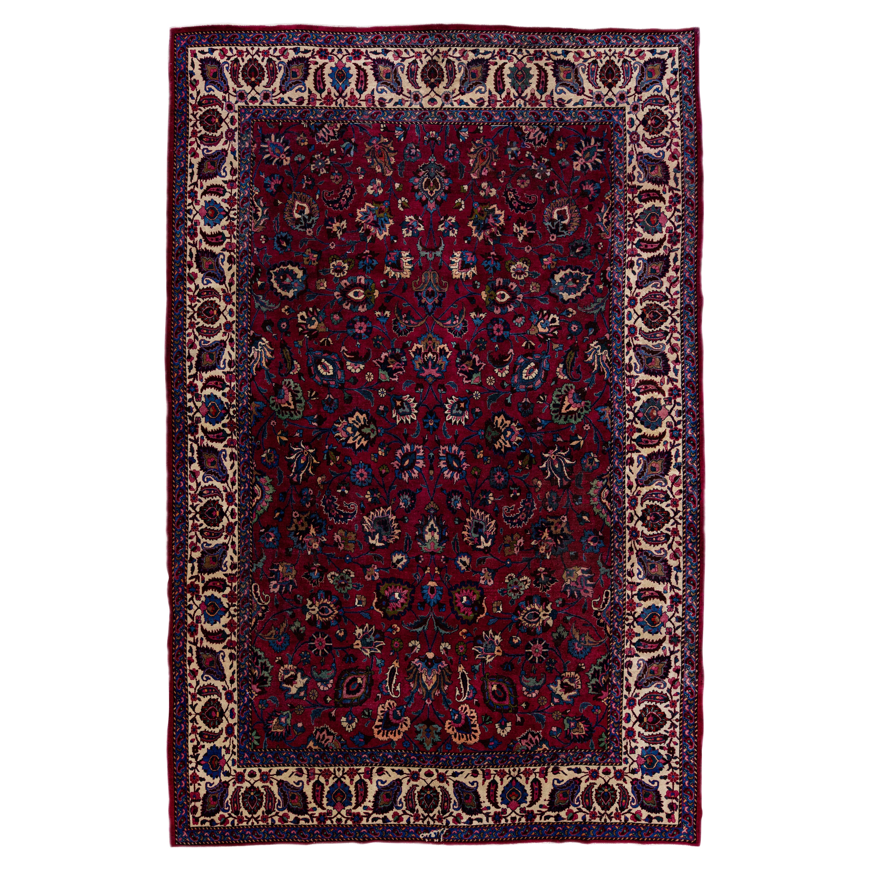 Ancien tapis Mashad en laine rouge à motifs floraux, fait à la main