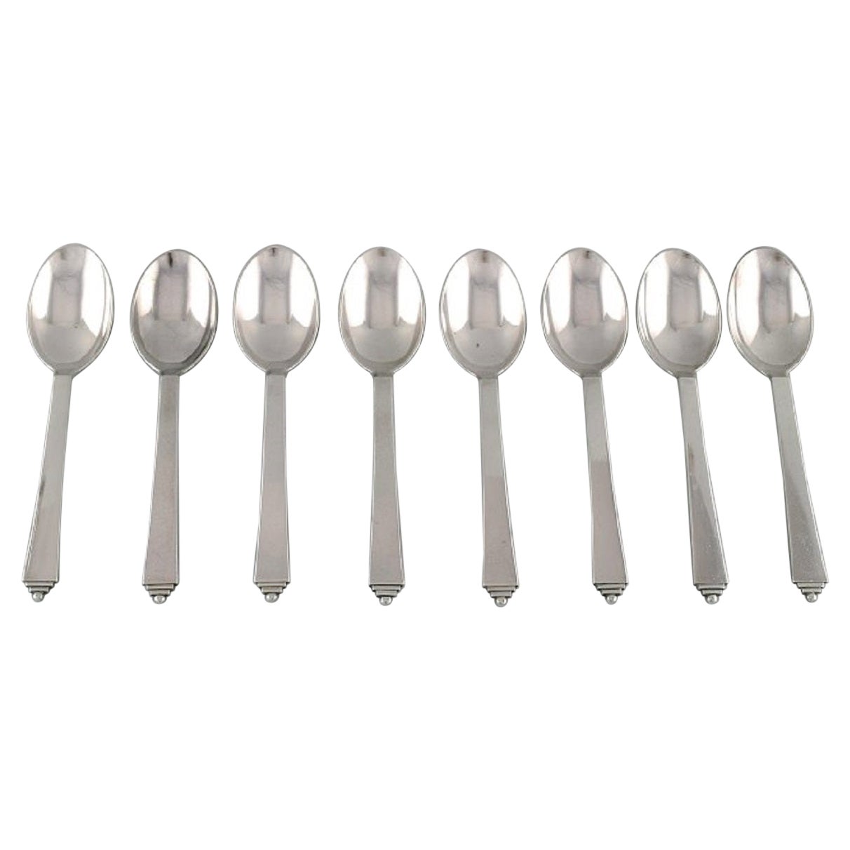 Eight Georg Jensen Pyramid Dessert Spoons in Sterling Silver