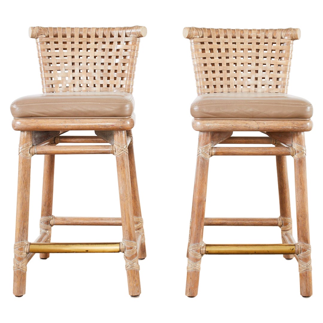 Pair of McGuire Laced Leather Rawhide Cerused Rattan Barstools