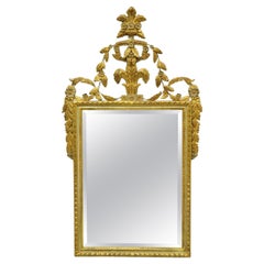 Vieux miroir mural italien en bois doré et sculpté avec volutes en cuir souple