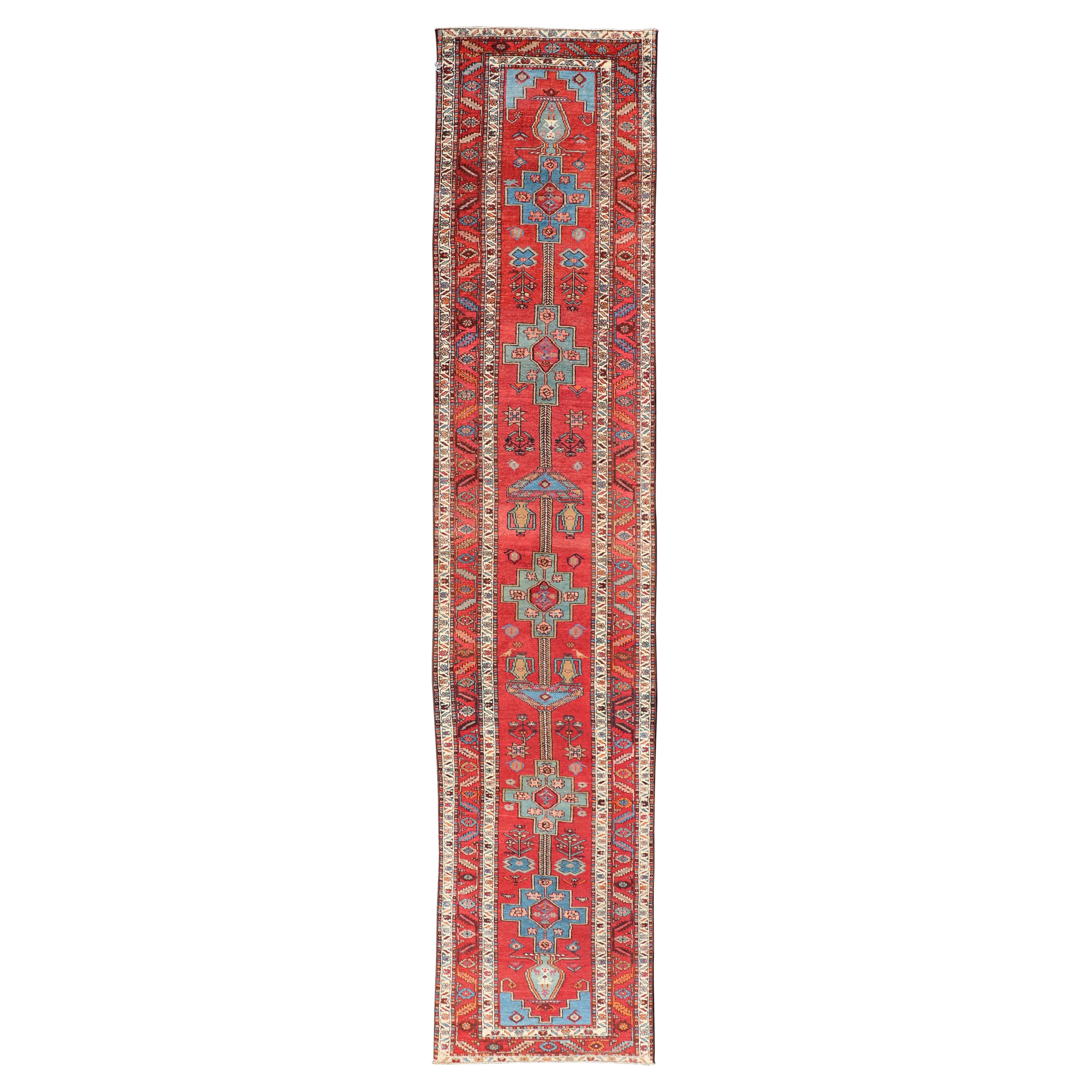 Antique Persian Long Persian Serapi Runner in Wool with Medallion Design For Sale