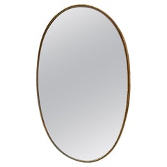 1960s Mid-Century Modern Italian Brass Brass Oval Mirror in the Manner of Giò Ponti (Miroir ovale italien en laiton à la manière de Giò Ponti)