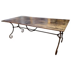 Early 20th Century Distressed Metal Table with Scrolled Legs and Feet