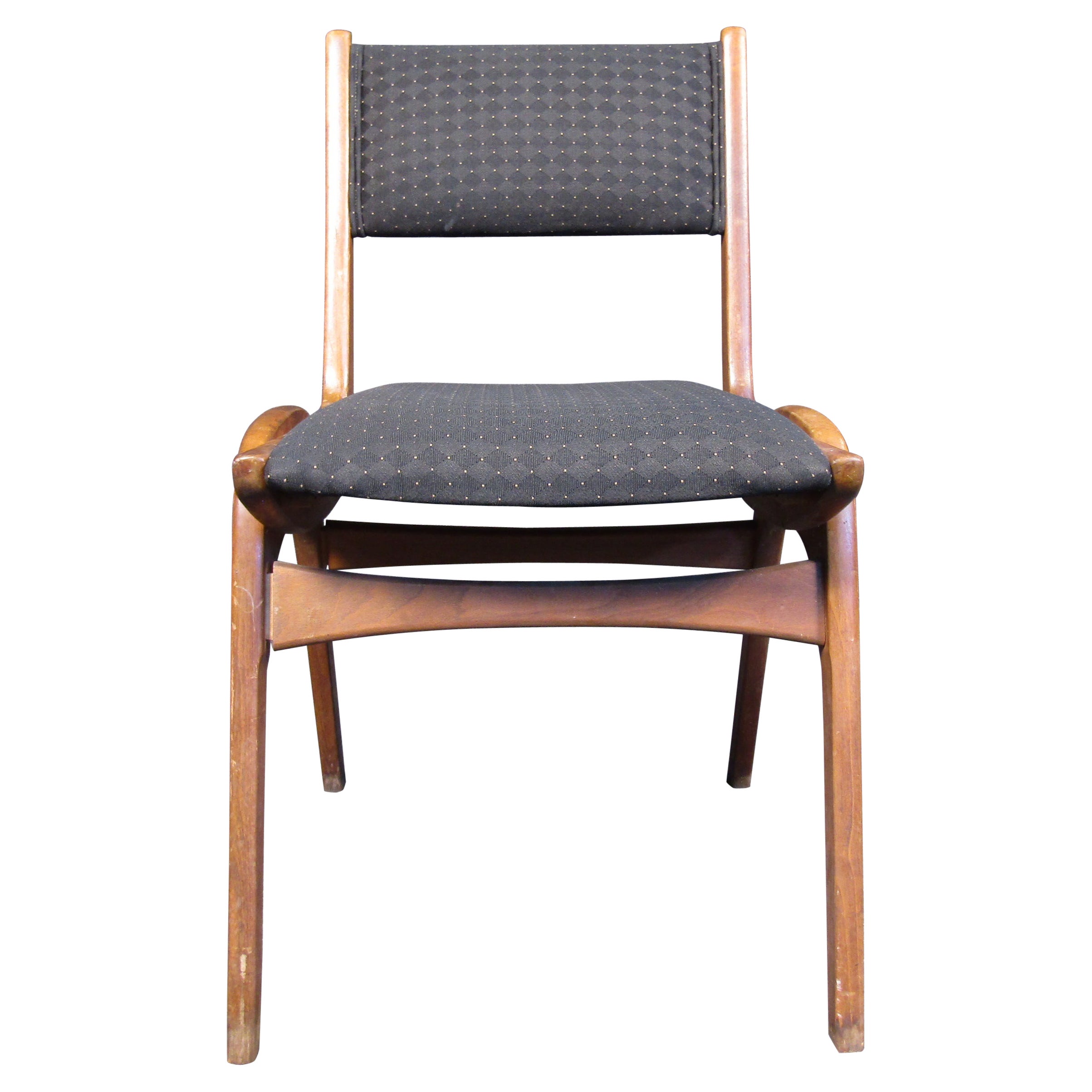 This beautiful Mid-Century Modern lounge chair features walnut hardwood frame and high back upholstered seat. Striking addition to home or office seating area. Please confirm item location (NY or NJ).